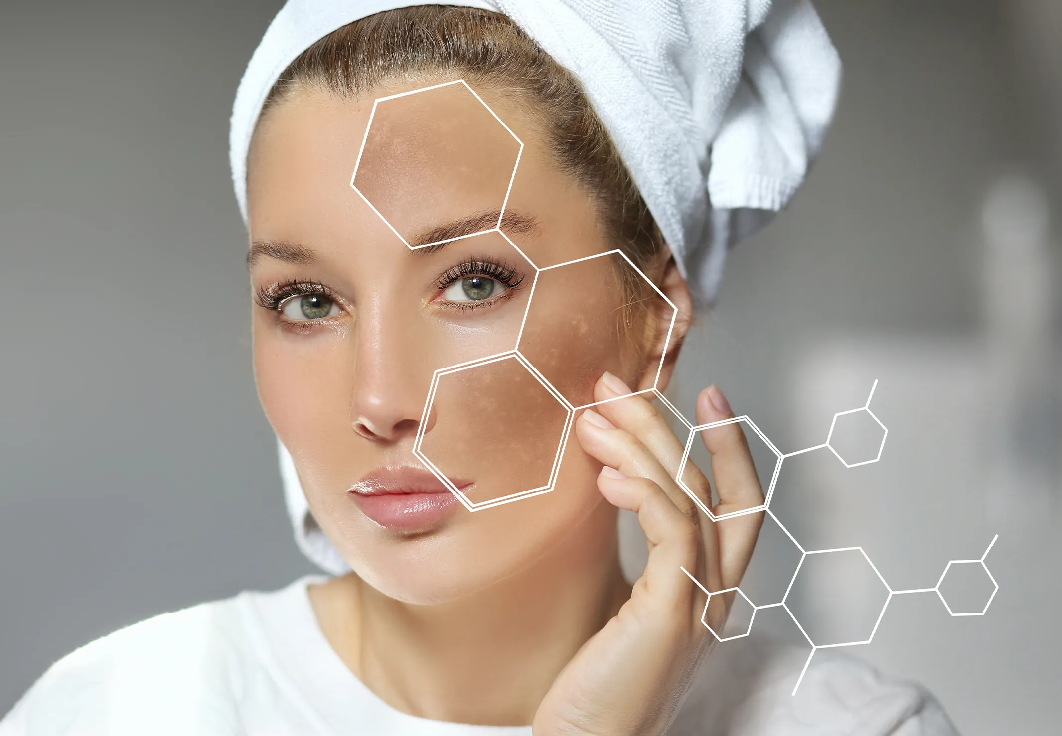A relaxed woman with hearts around her head as she's getting facial cream spread on her face