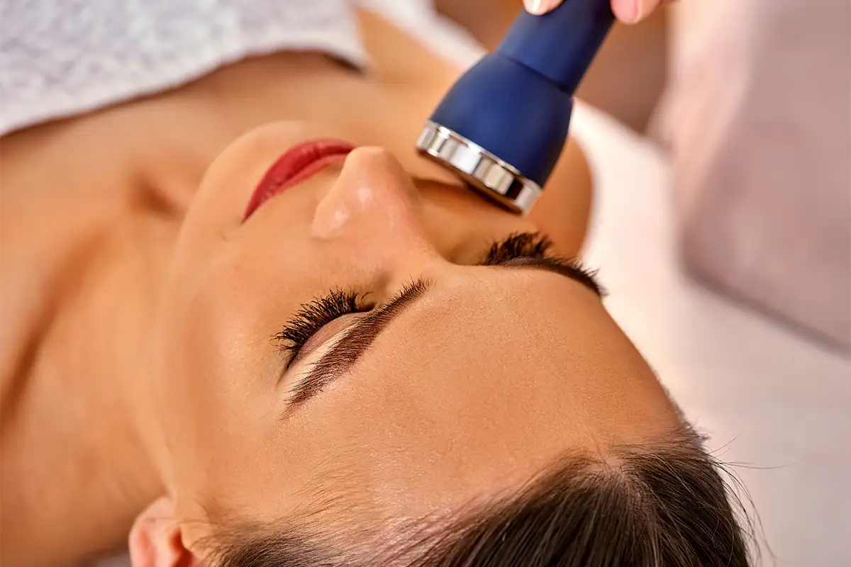 Woman getting Electrical Muscle Stimulation services
