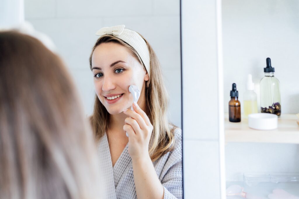 Dermaroller held gently against the skin during an at-home skincare routine perfect for the Cape Coral weather.