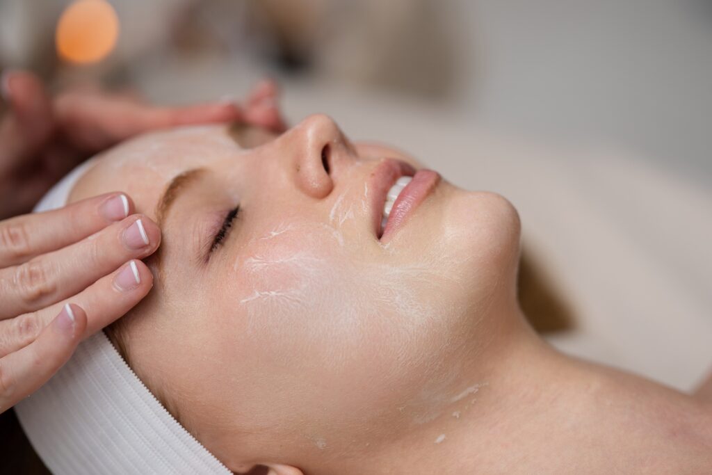 Professional facial treatment with a soothing skincare mask applied at a spa.

