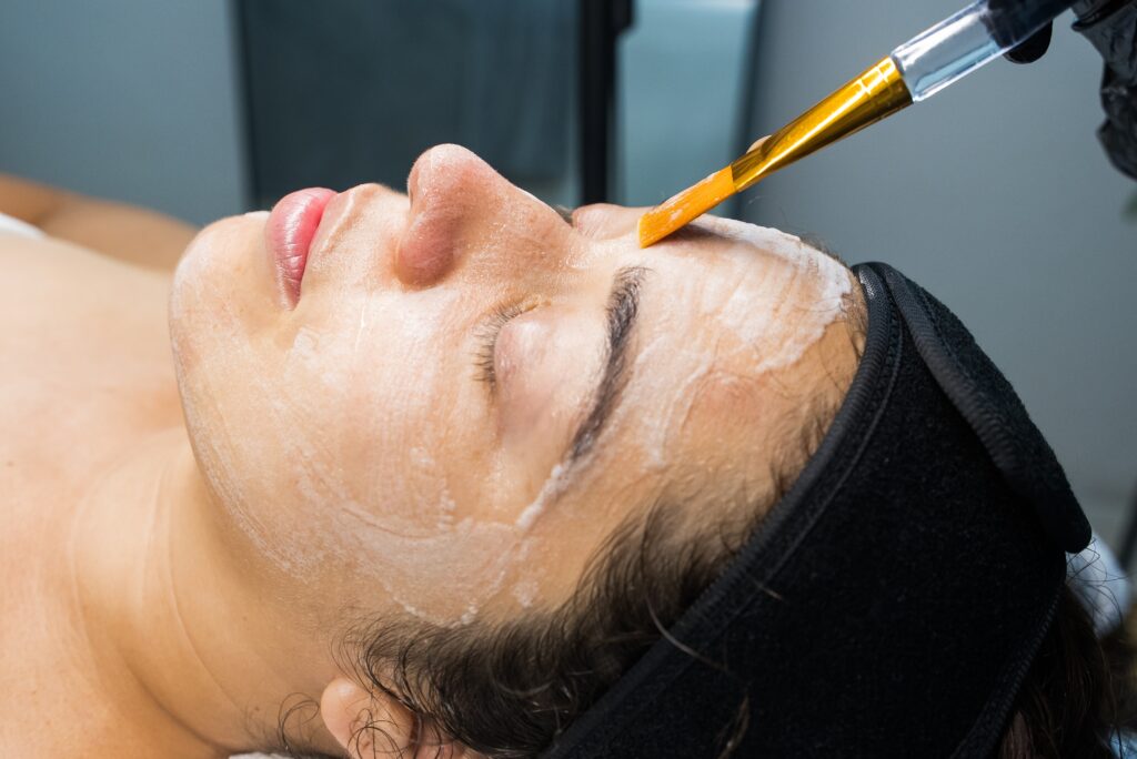 Client receiving a professional facial treatment designed to improve skin tone and reduce visible discoloration.