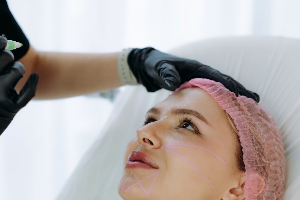 Client receiving an advanced exosome facial treatment designed to support smoother, brighter, rejuvenated-looking skin.